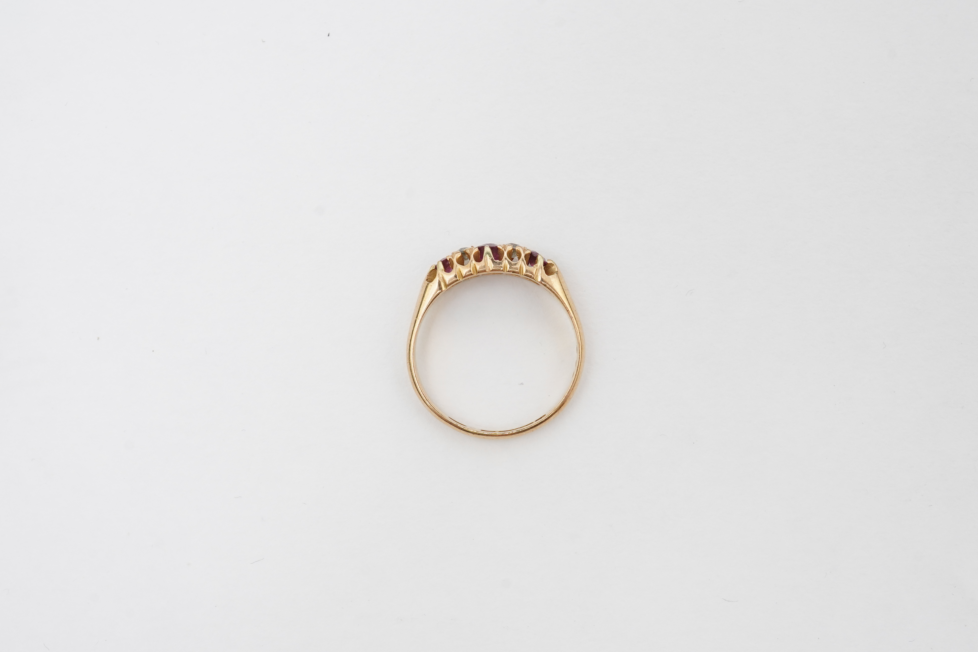 A ruby and diamond five-stone ring, circa 1900